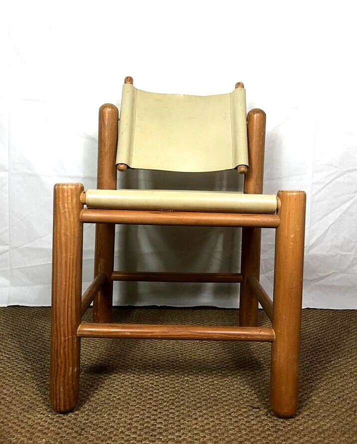 Wooden and leather chair with swivel back