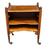 Vintage bedside table on wheels made of solid wood from the 1950s.