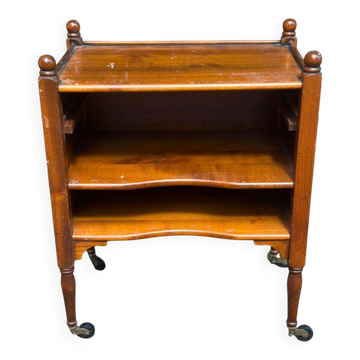 Vintage bedside table on wheels made of solid wood from the 1950s.
