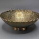 Engraved brass bowl from the mid-20th century with a scalloped edge.