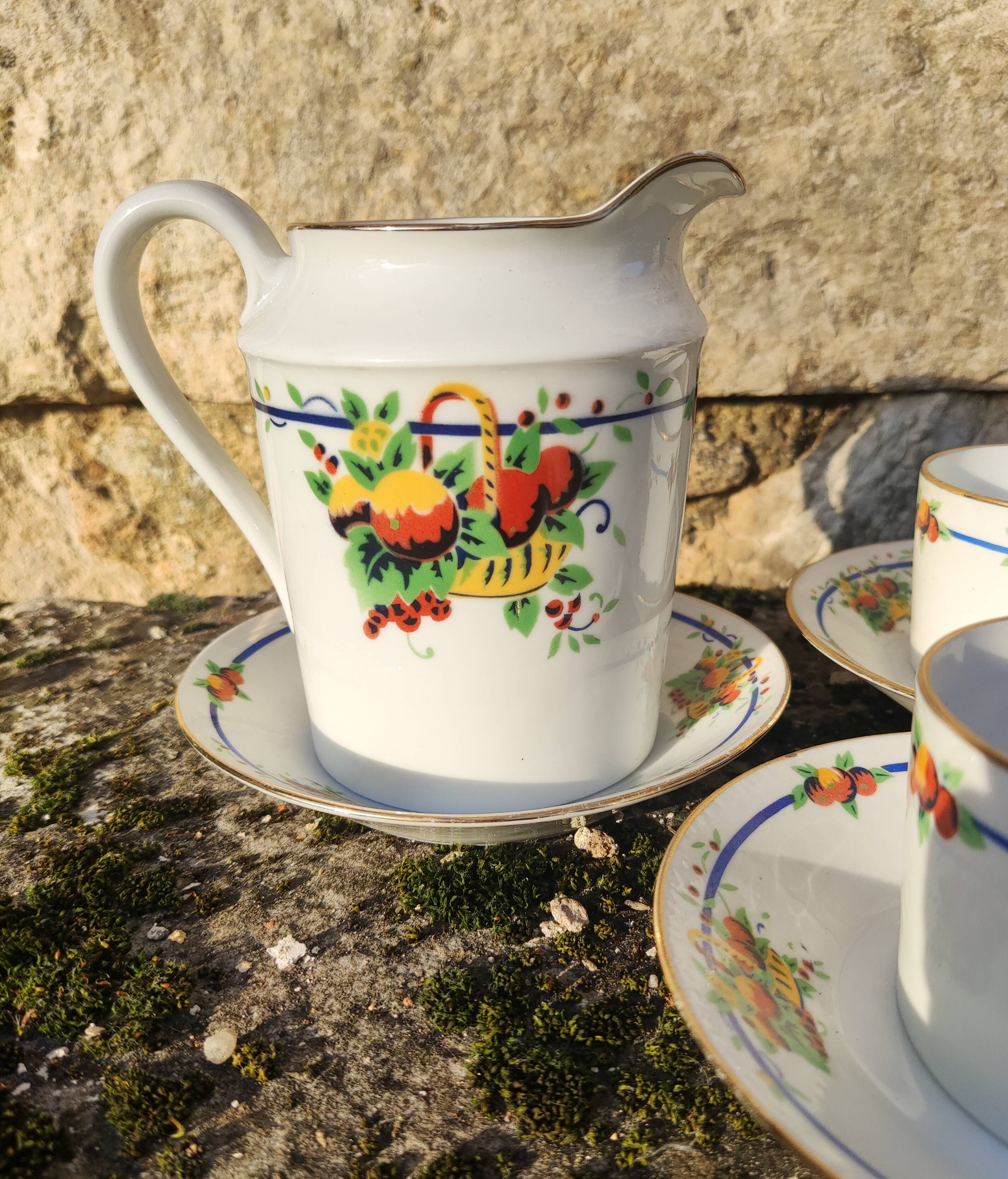 10 tea cups and creamer in Limoges porcelain