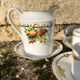 10 tea cups and creamer in Limoges porcelain