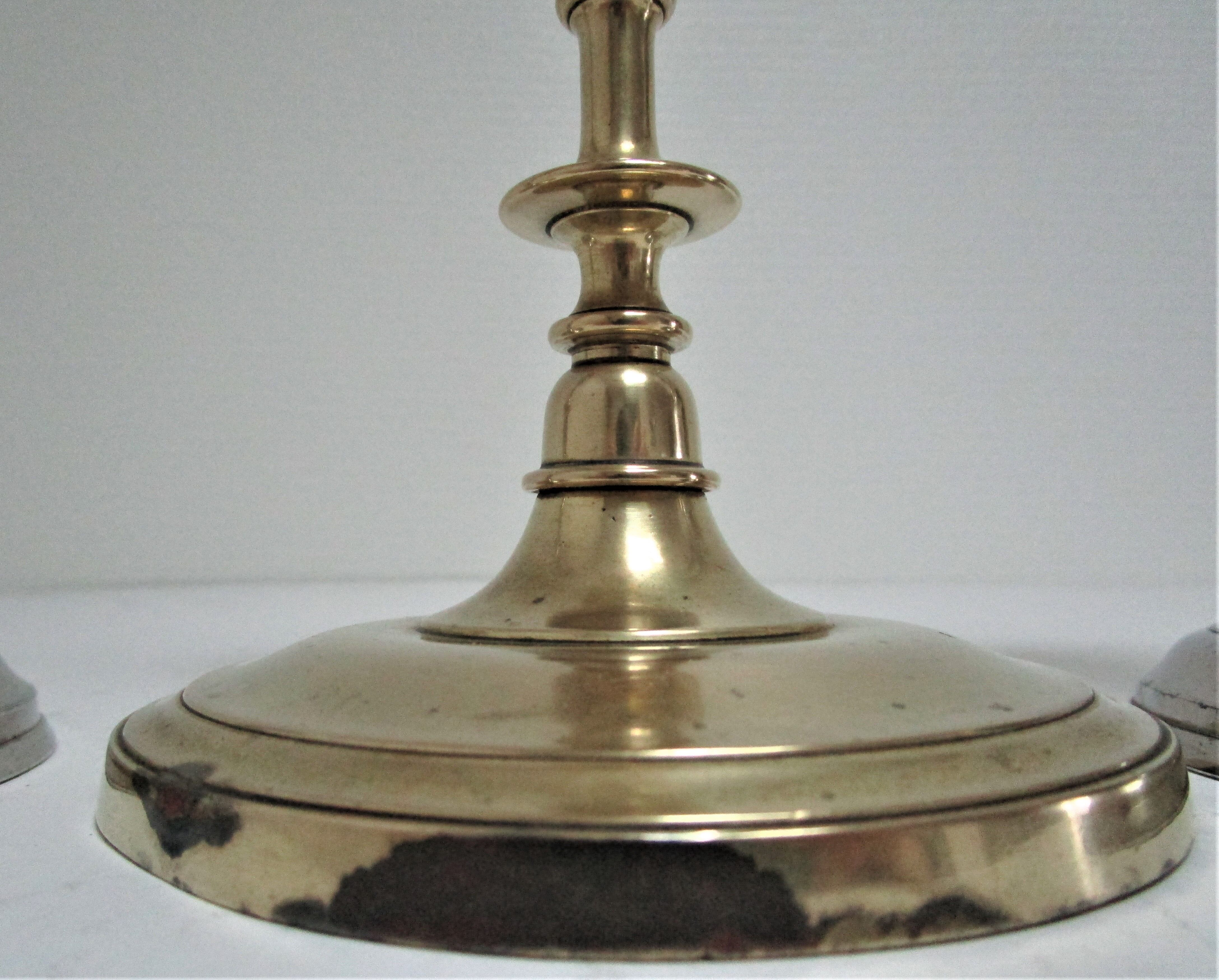 three brass and chrome candle holders early twentieth century