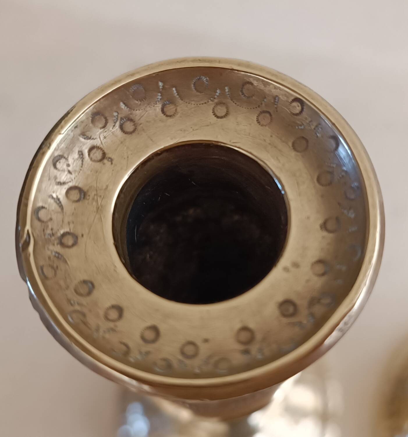 Pair of chiseled brass candlesticks