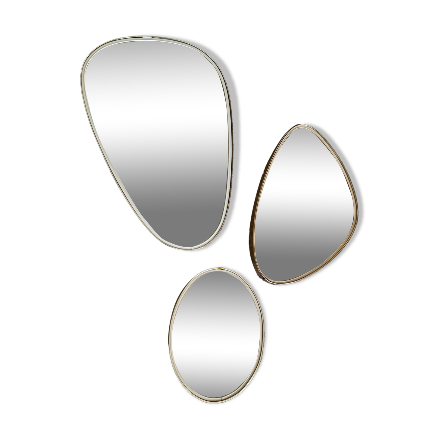 Trio of asymmetrical free-form mirrors from the 60s and 70s