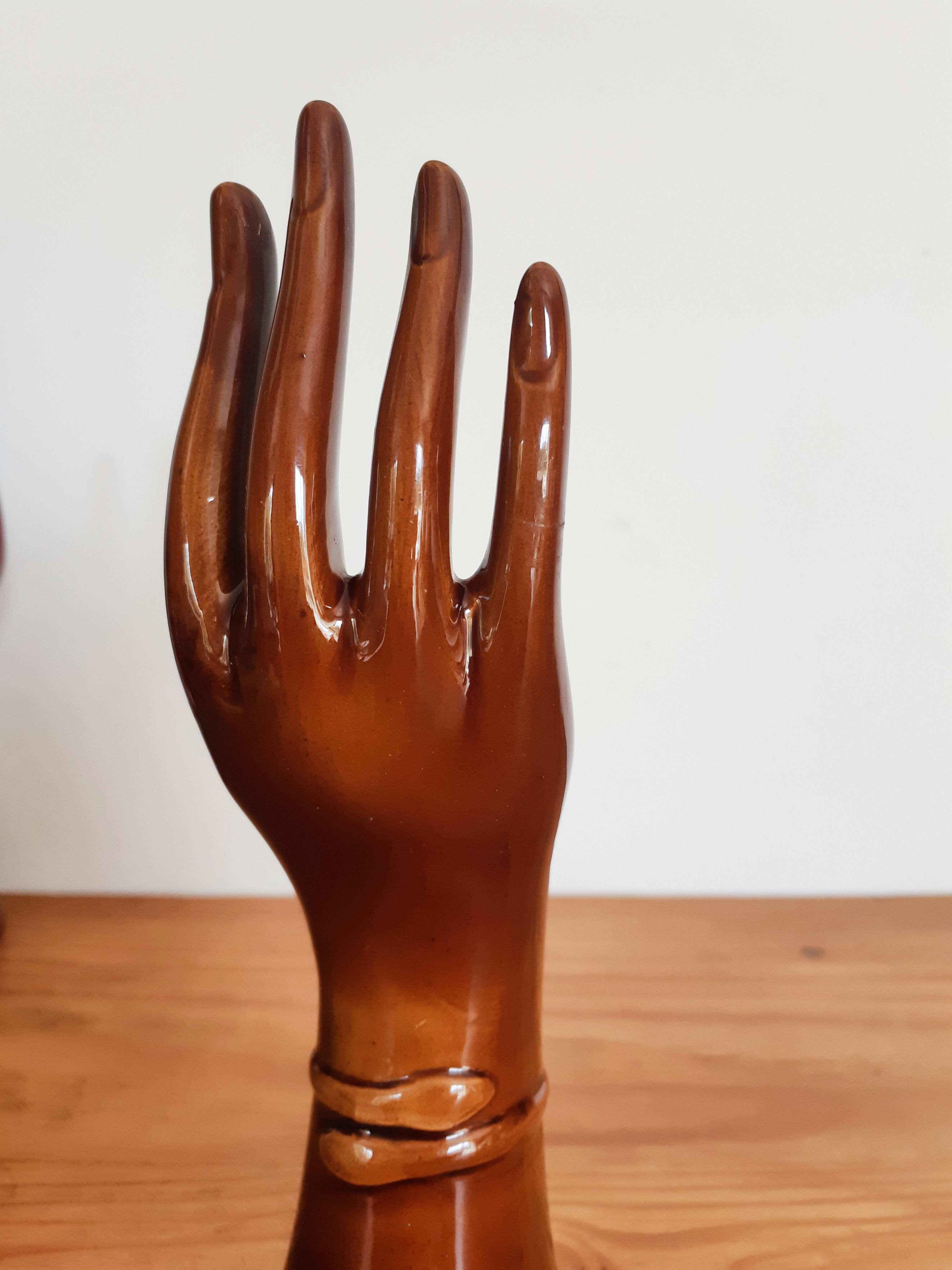 Hand wears brown jewelry , ring, soliflore , vintage French , 50s