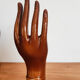 Hand wears brown jewelry , ring, soliflore , vintage French , 50s