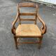 Louis Philippe country armchair in solid wood and straw, hooked armrests