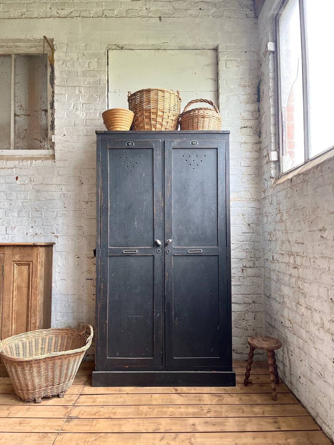 Old wooden locker with black patina