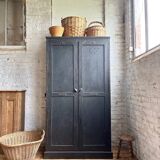 Old wooden locker with black patina