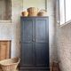 Old wooden locker with black patina