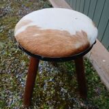 Antique tripod stool in wood and cowhide