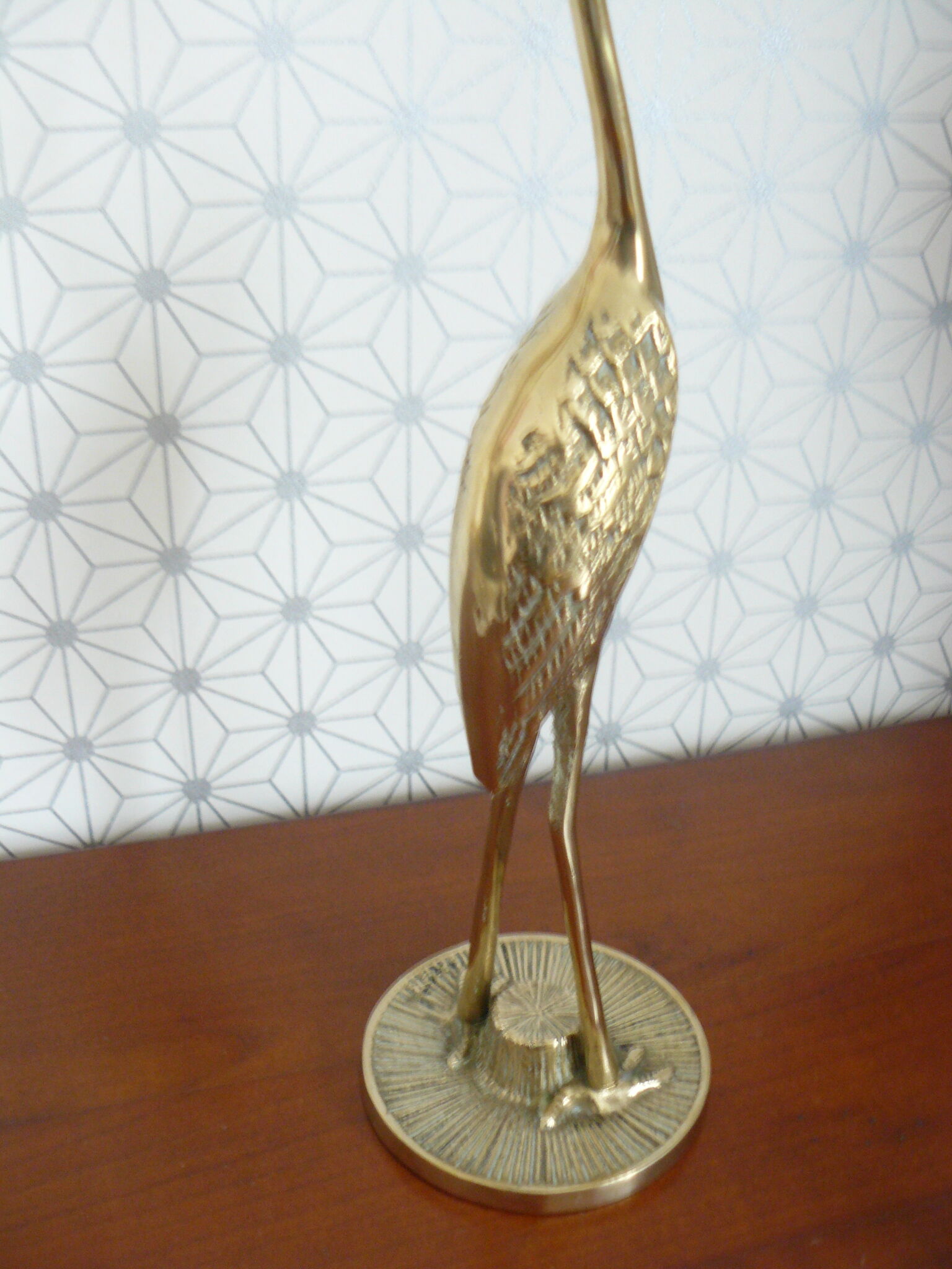 Heron in vintage brass