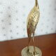 Heron in vintage brass