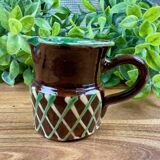 Small vintage ceramic jug in brown glazed with geometric design.