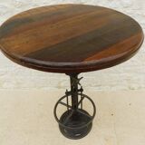 Unique bistro table with its adjustable industrial cast iron leg