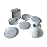 White Limoges porcelain tableware with gold trim.