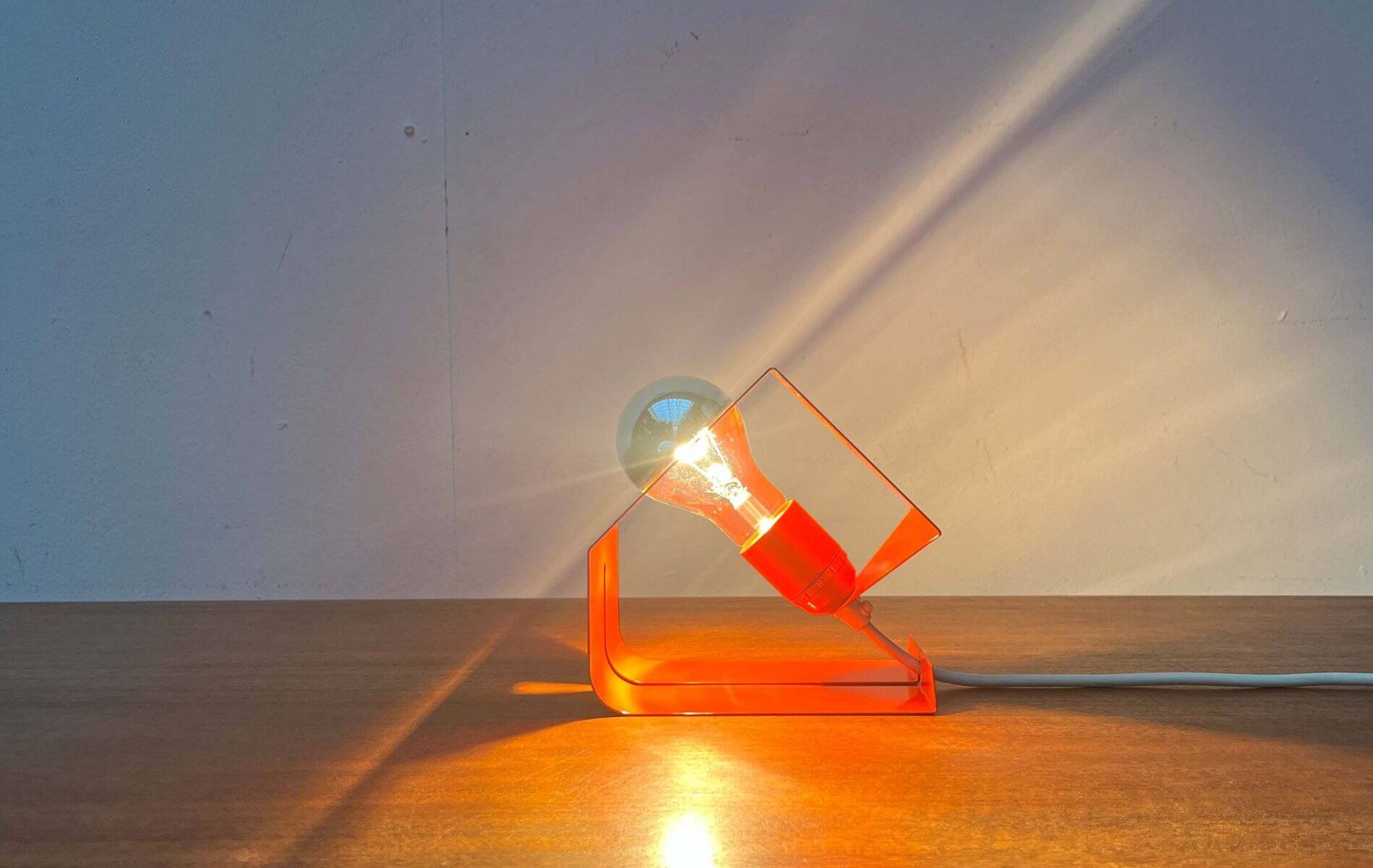 Orange metal table lamp, minimalist, modern mid-century space age, 1960s.