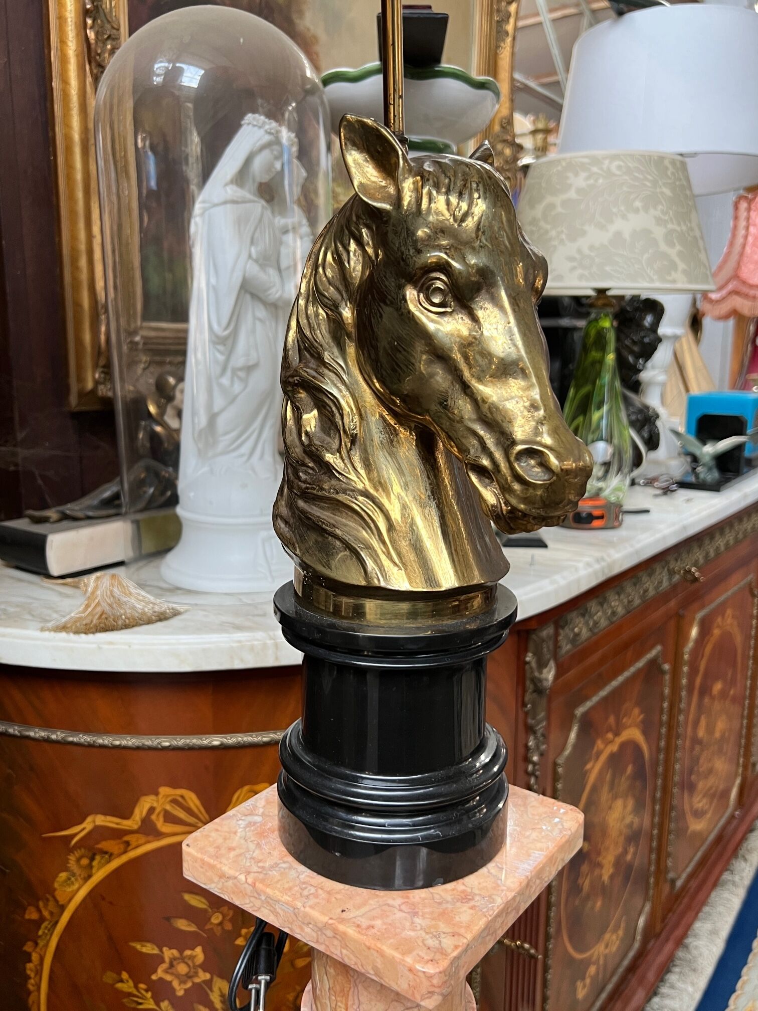 Table lamp made of solid bronze on a marble base.