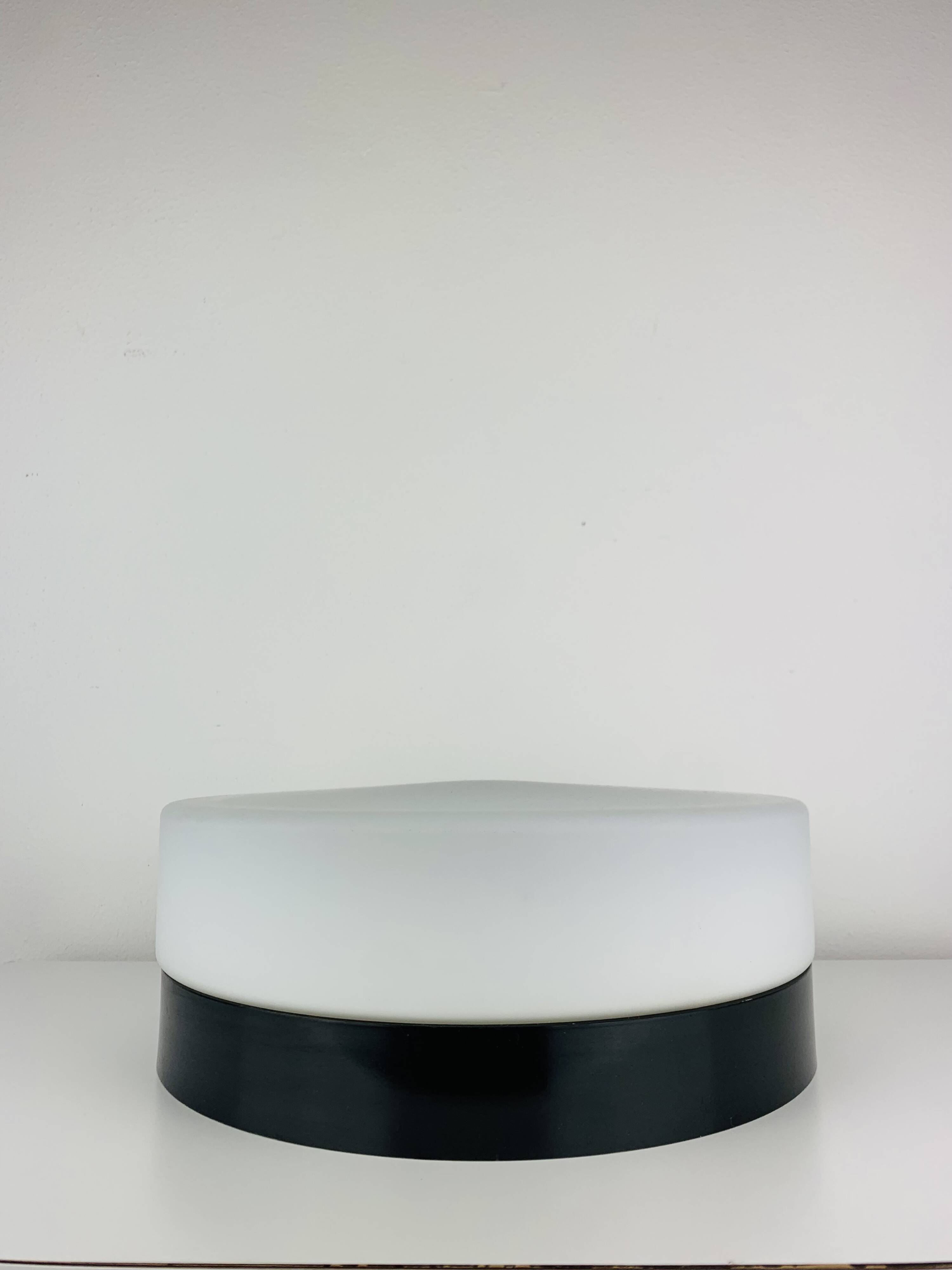 Erco round opaline wall light from the 1960s