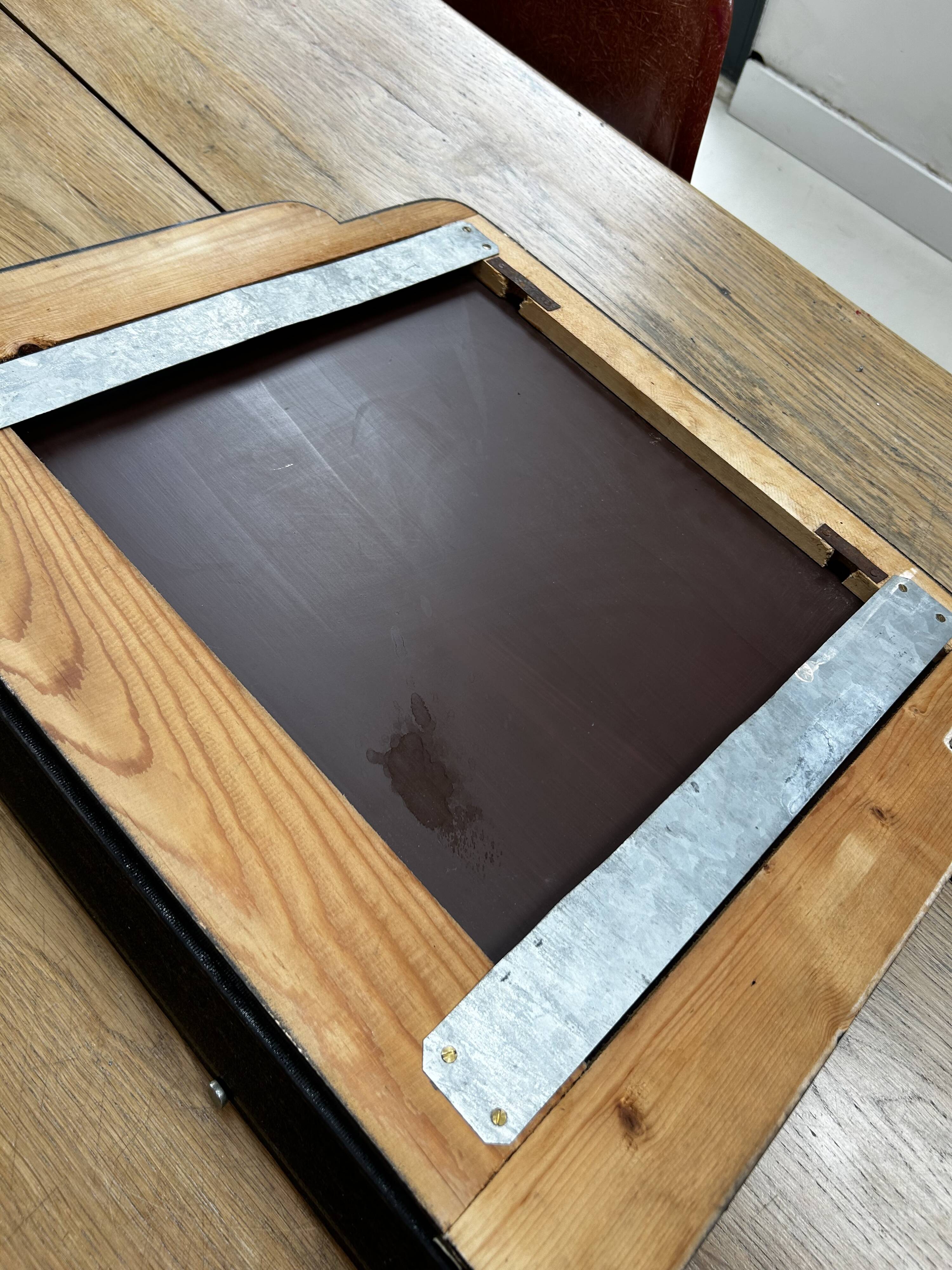 Vintage black mirror from the 1930s/40s with shelf.