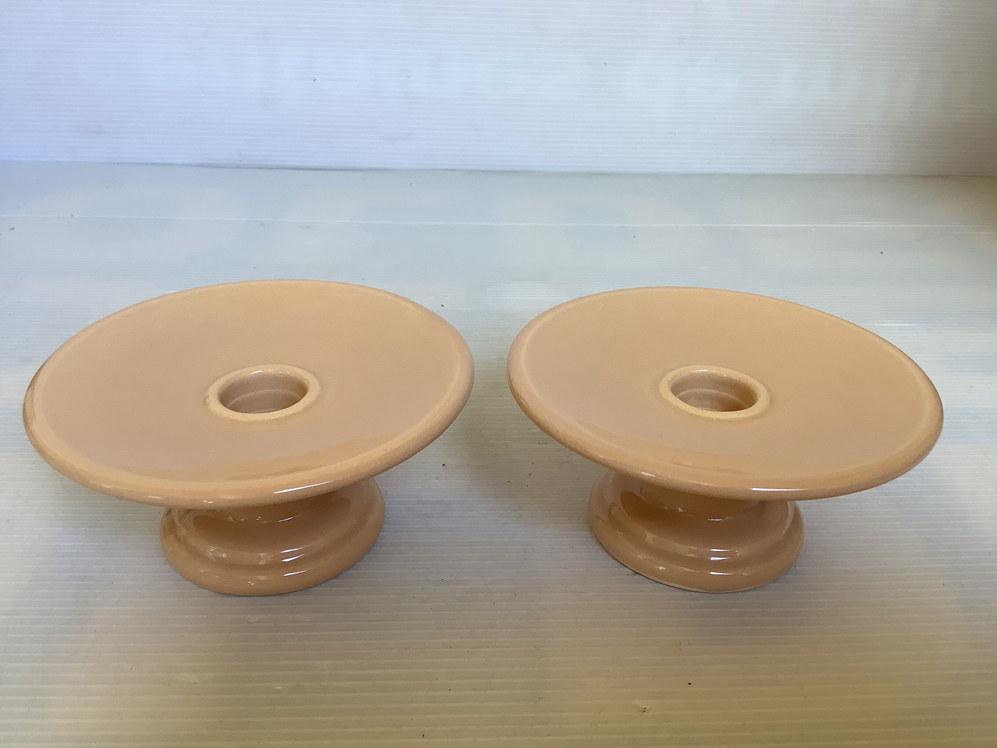 Pair of beige candlesticks
