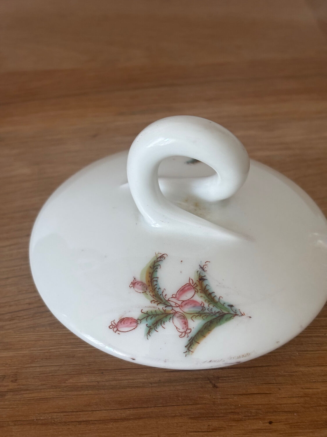 Beautiful vintage porcelain sugar bowl with a floral pattern.