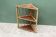 Rattan corner shelf