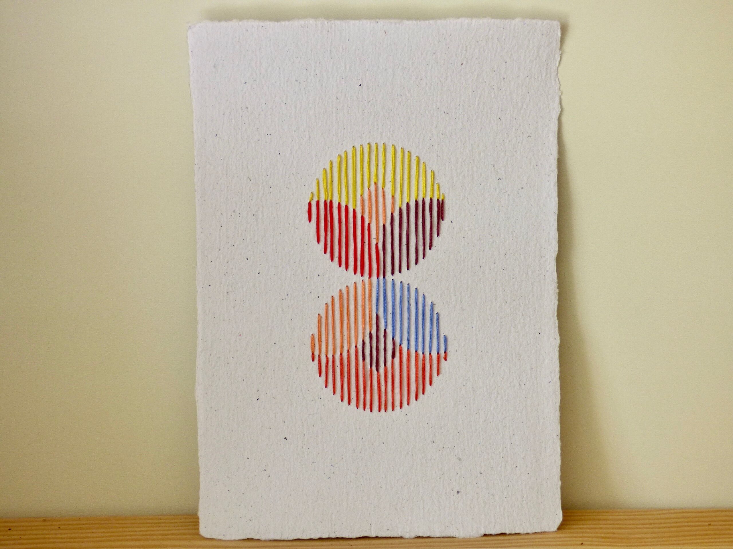 hand-embroidered card on recycled paper