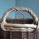 Very large oval laundry basket in two-tone braided wicker with handles