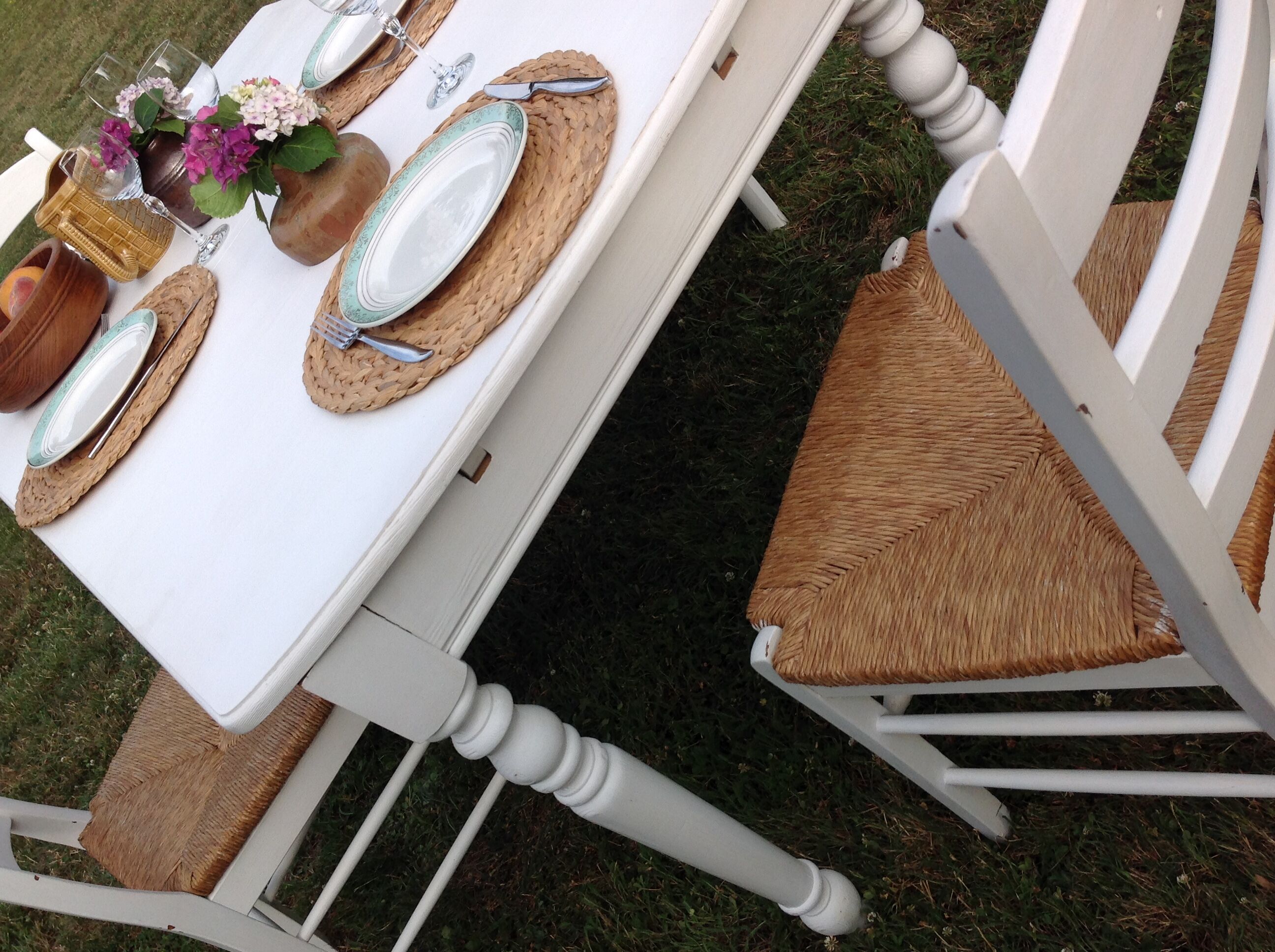 White farmhouse table set and four chairs