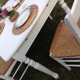 White farmhouse table set and four chairs