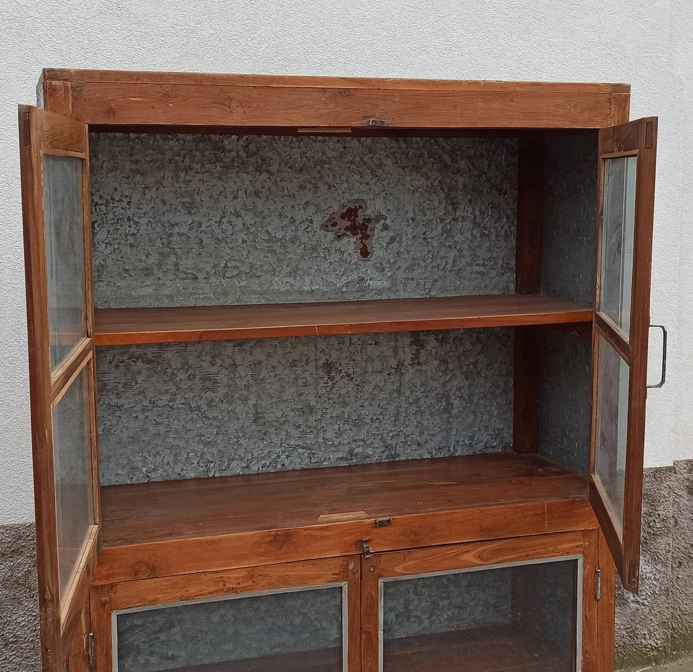 Old glass cabinet in wood and metal