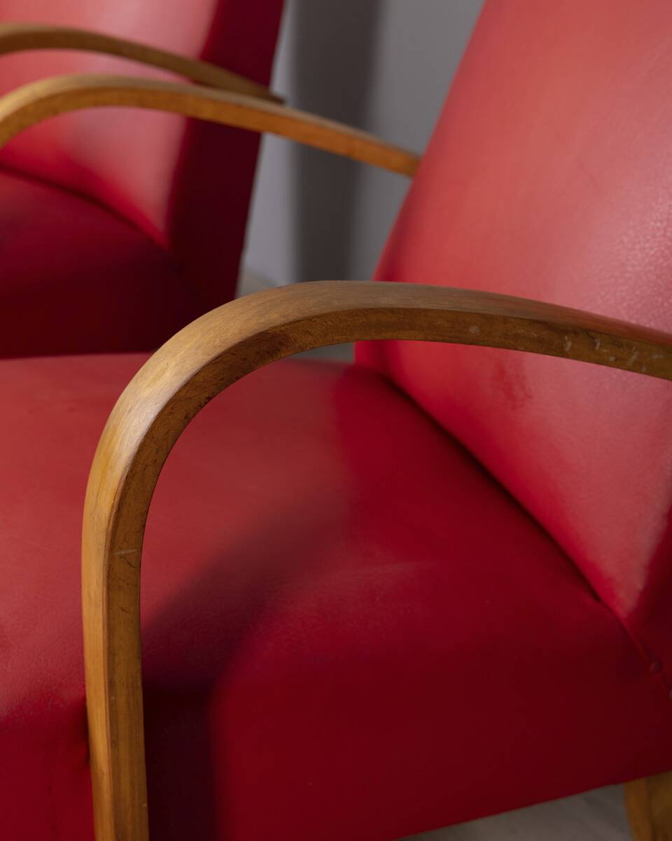 Pair of vintage 1950's armchairs in red leather, italian design