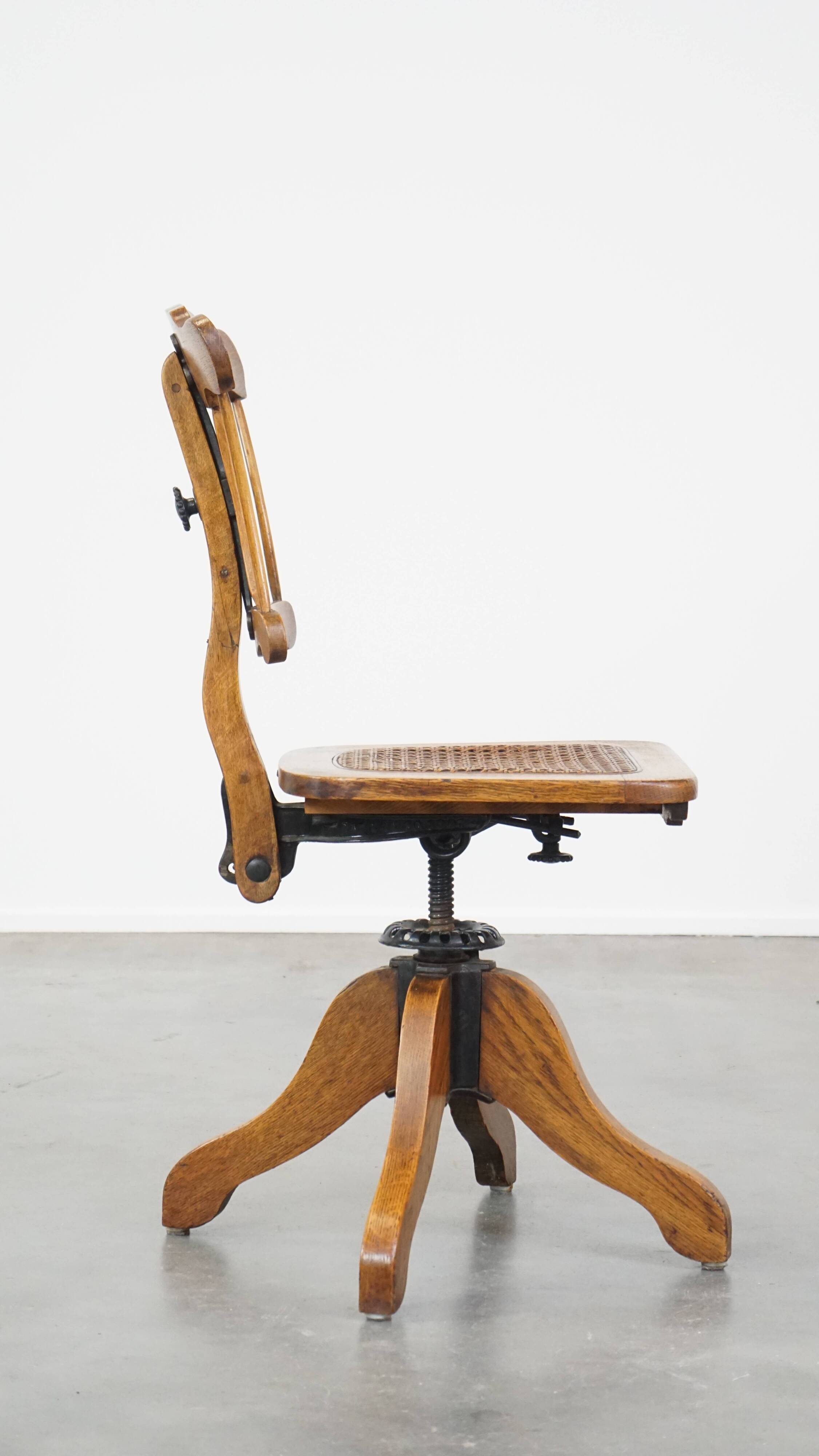 Antique late 19th century English office chair with reclining backrest and height adjustable