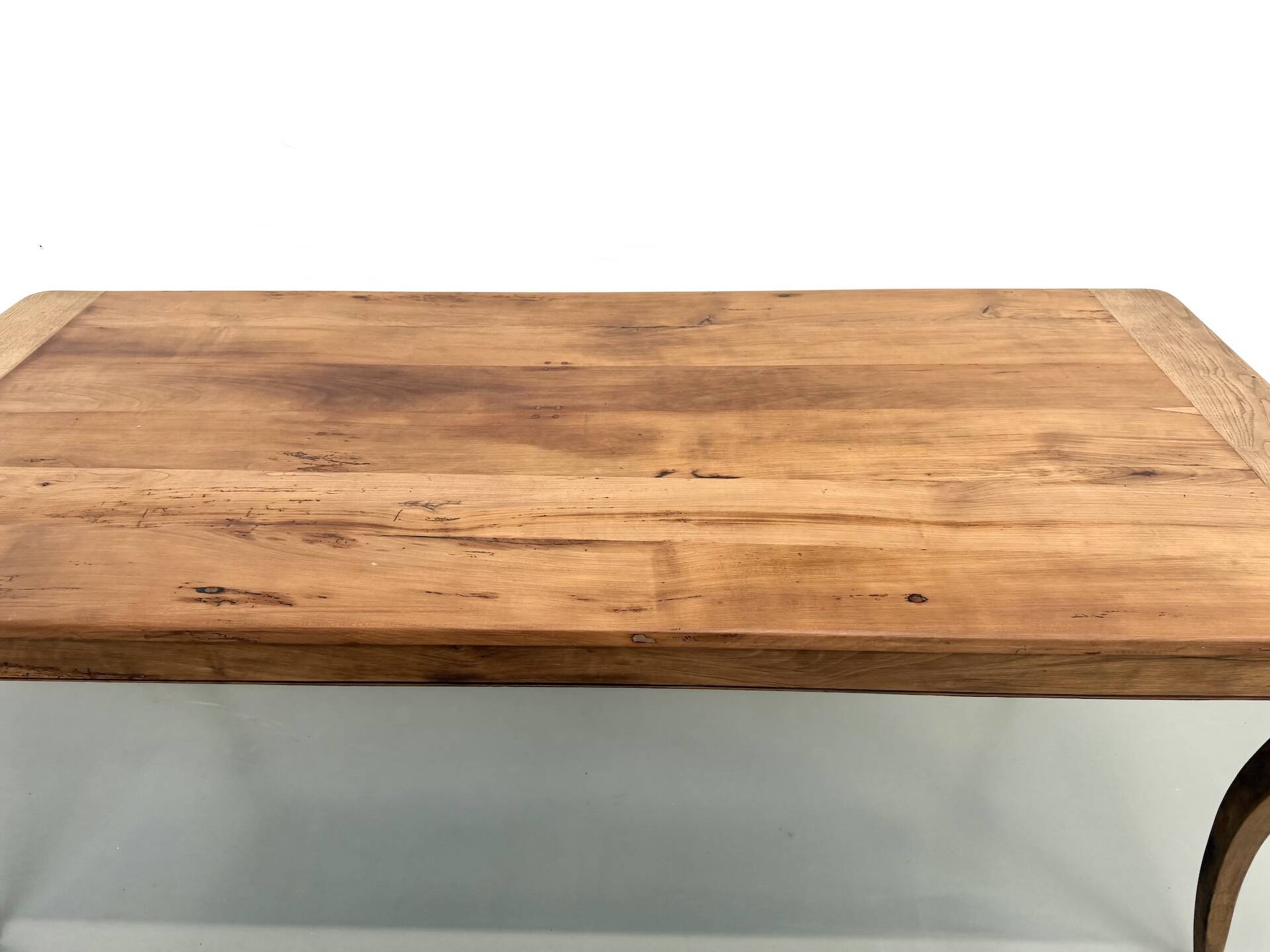 Farm table in solid cherry — Saber legs, Circa 1880