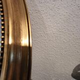 Miroir ovale à noeud doré  en bois