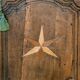 Antique French rustic wardrobe with star inlays.