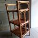 Shelf selette on wooden feet and vintage rattan