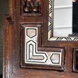 Oriental mirror in carved and turned wood inlaid with mother-of-pearl H 44/L 38 cm
