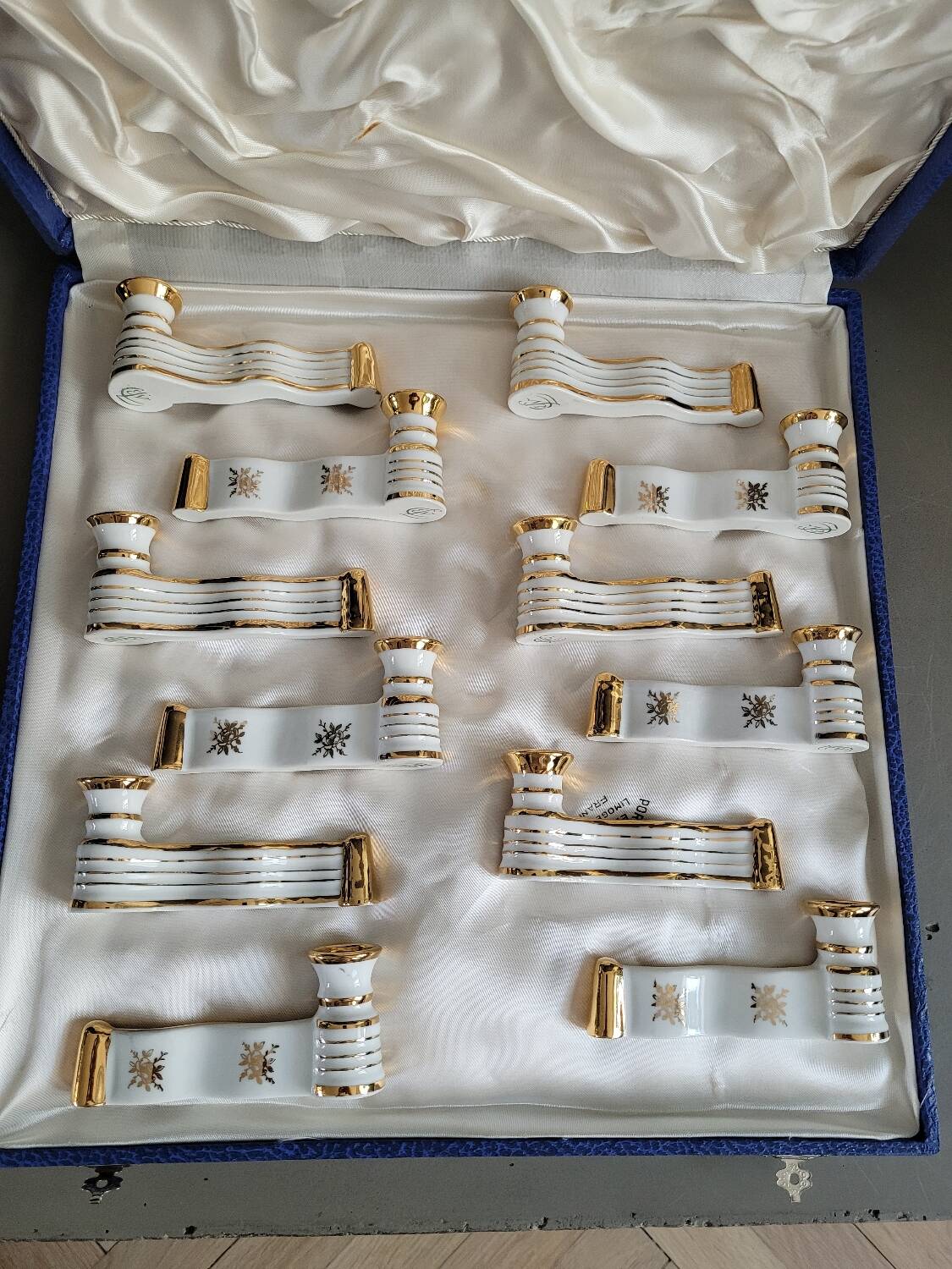 12 Limoges art porcelain knife rests in their case