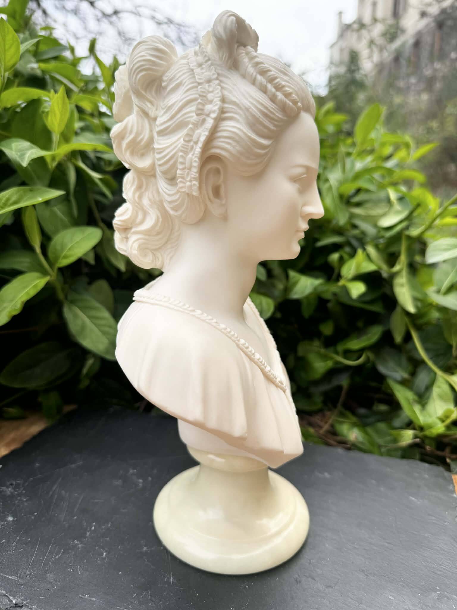 Alabaster bust of a woman signed Arnaldo Giannelli dated 1980.