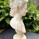 Alabaster bust of a woman signed Arnaldo Giannelli dated 1980.