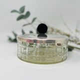 Vintage box made of chiseled glass and covered metal, taken in black Bakelite