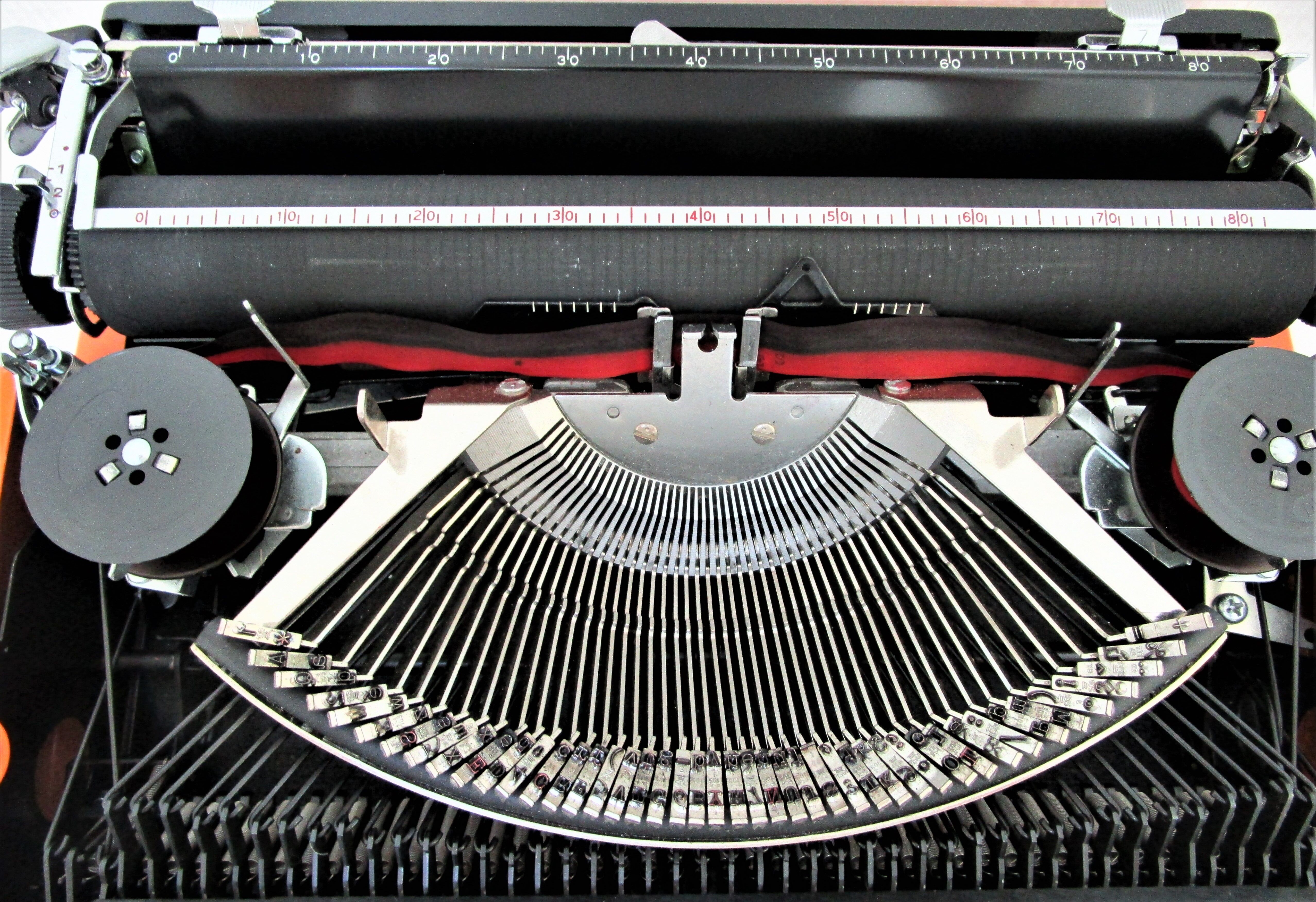 Silver Reed 200 orange metal typewriter made in Japan 70s