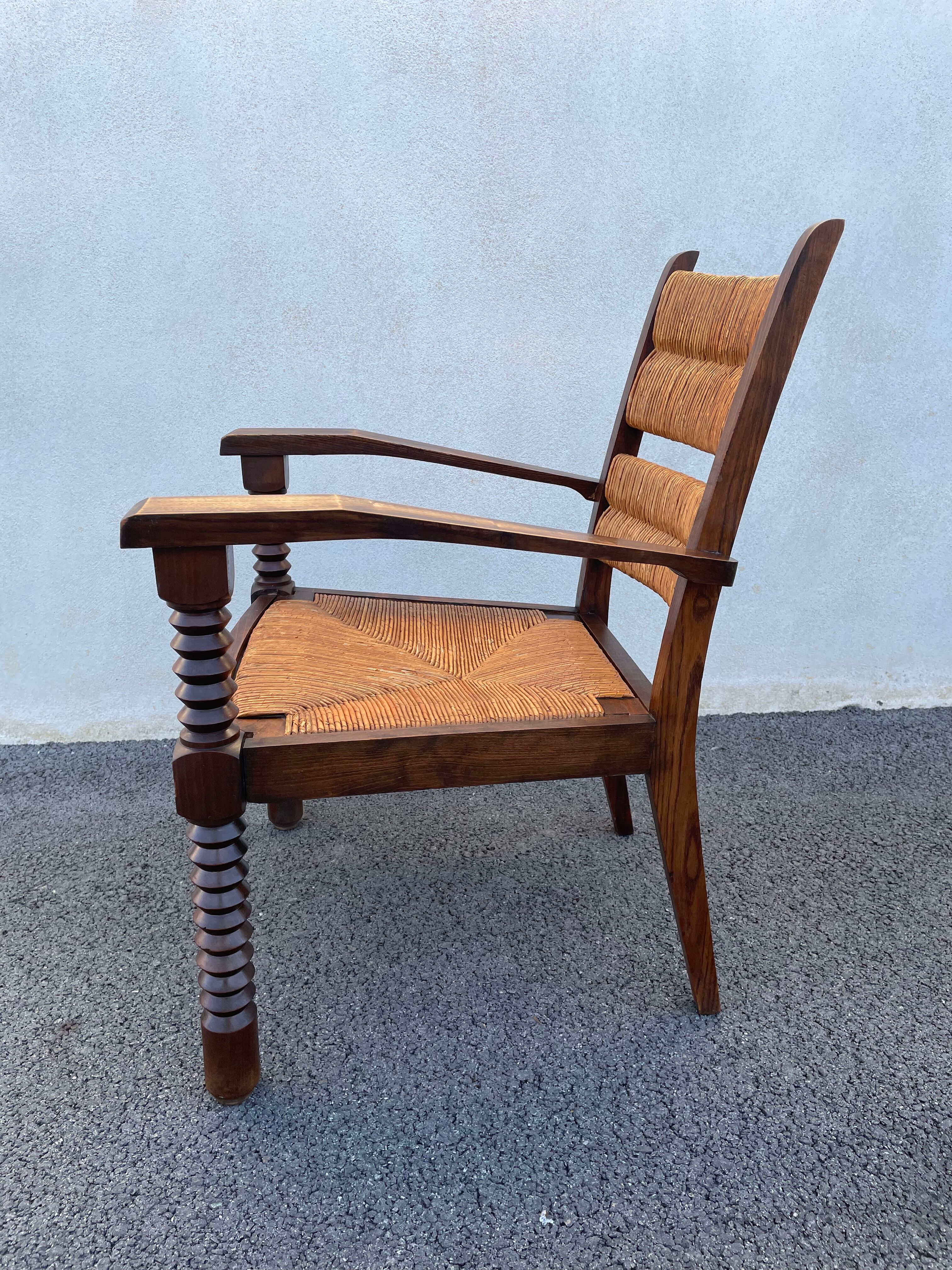Vintage armchair in straw and brutalist wood