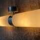 Wall light design in opaline and chrome metal