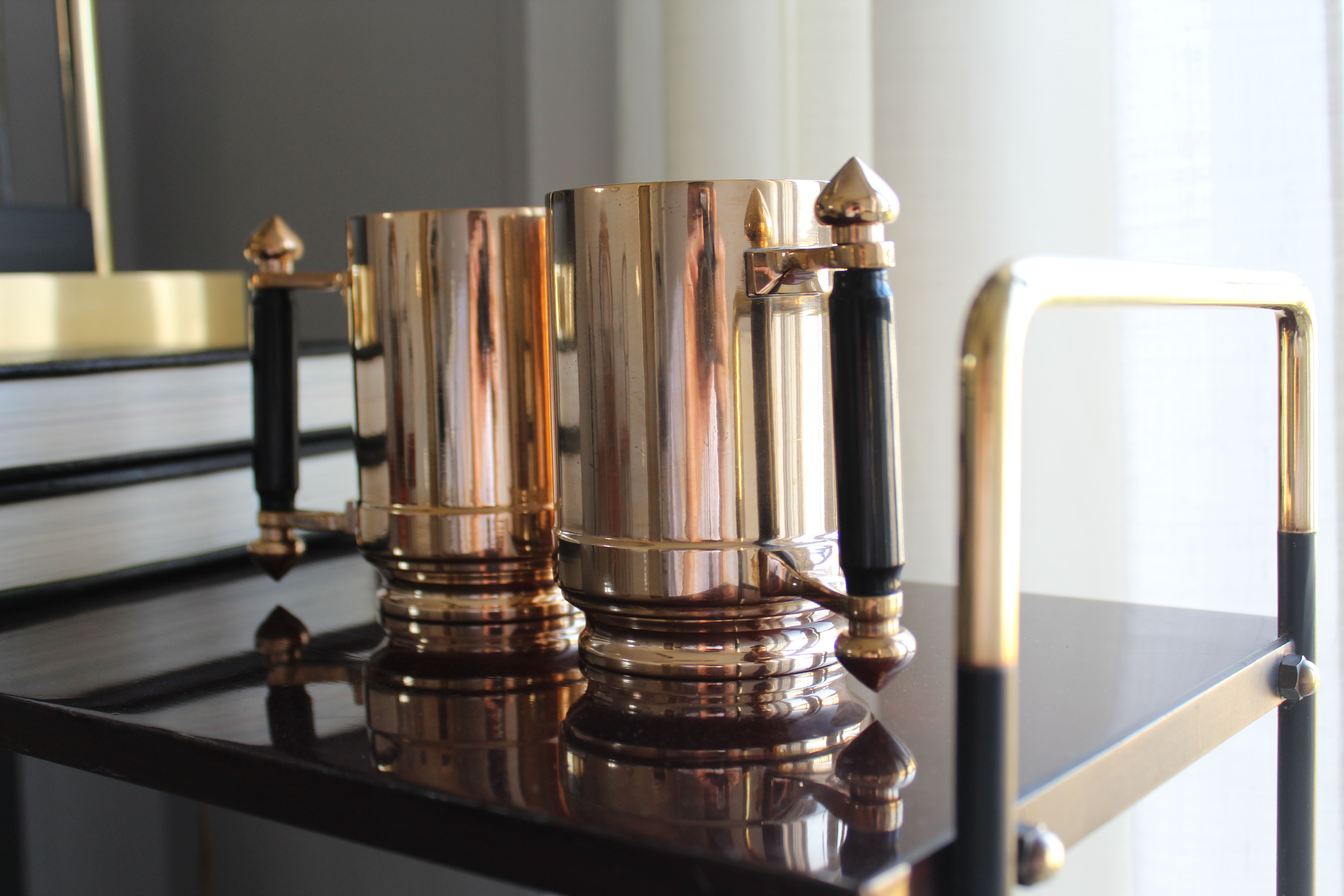 Pair of art deco bronze beer mugs France, 1940s, signed Bronze Star