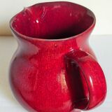 Vintage red enamel ceramic pitcher