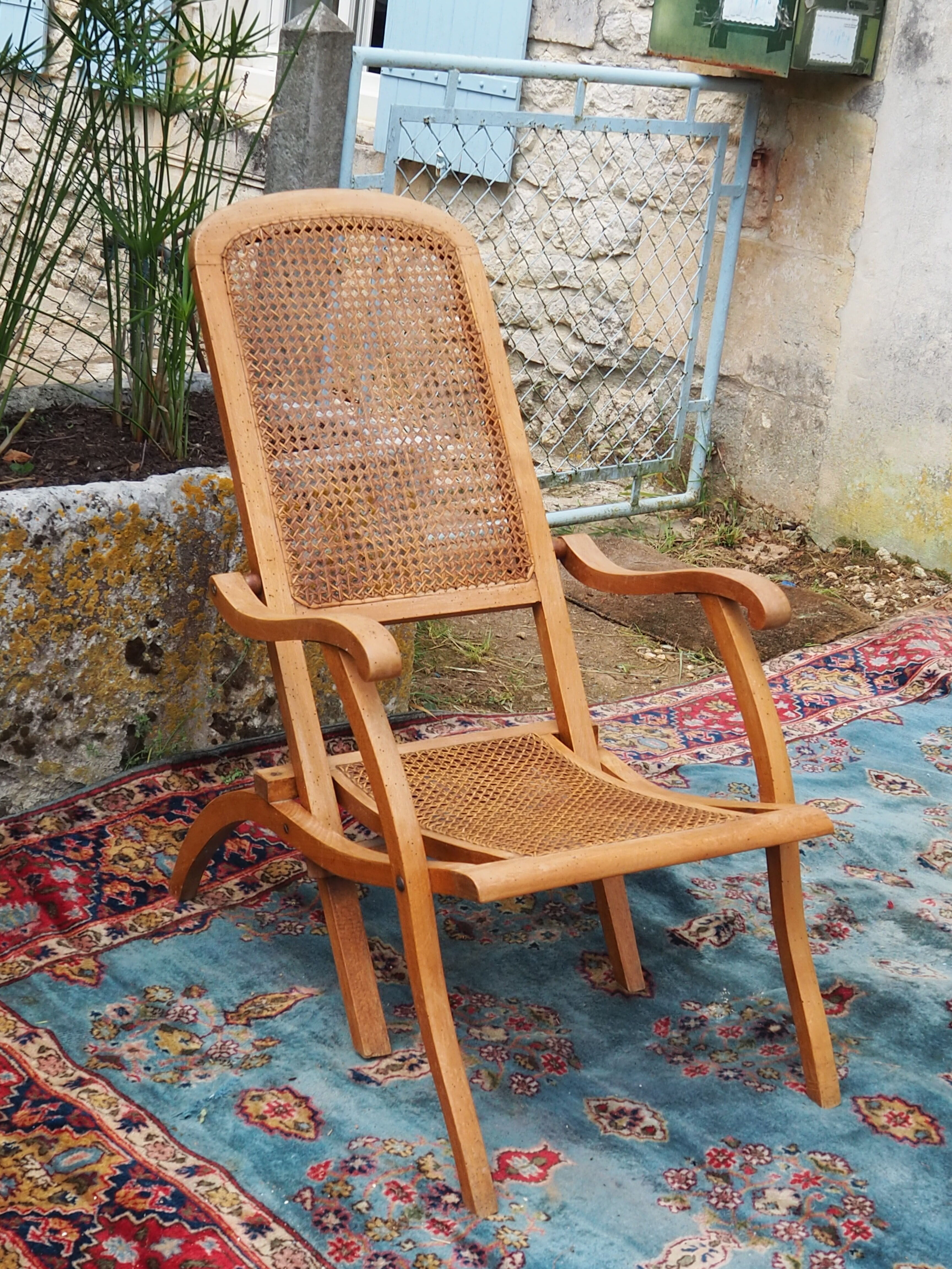 Cane folding armchair in solid wood